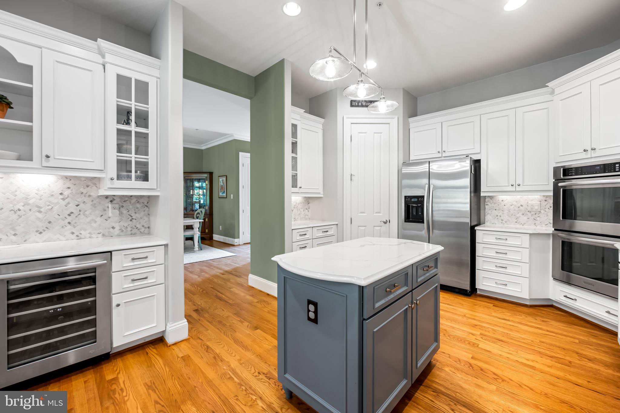 6509 Abbey View Way, Unit 22 Baltimore, MD 21212 - Photo 15 of 54 a kitchen with stainless steel appliances a stove oven and refrigerator