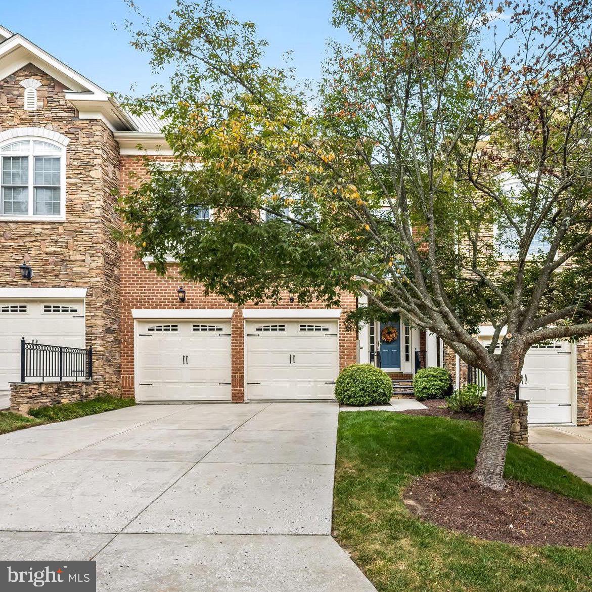 6509 Abbey View Way, Unit 22 Baltimore, MD 21212 - Photo 2 of 54 a white house that has tree in front of it