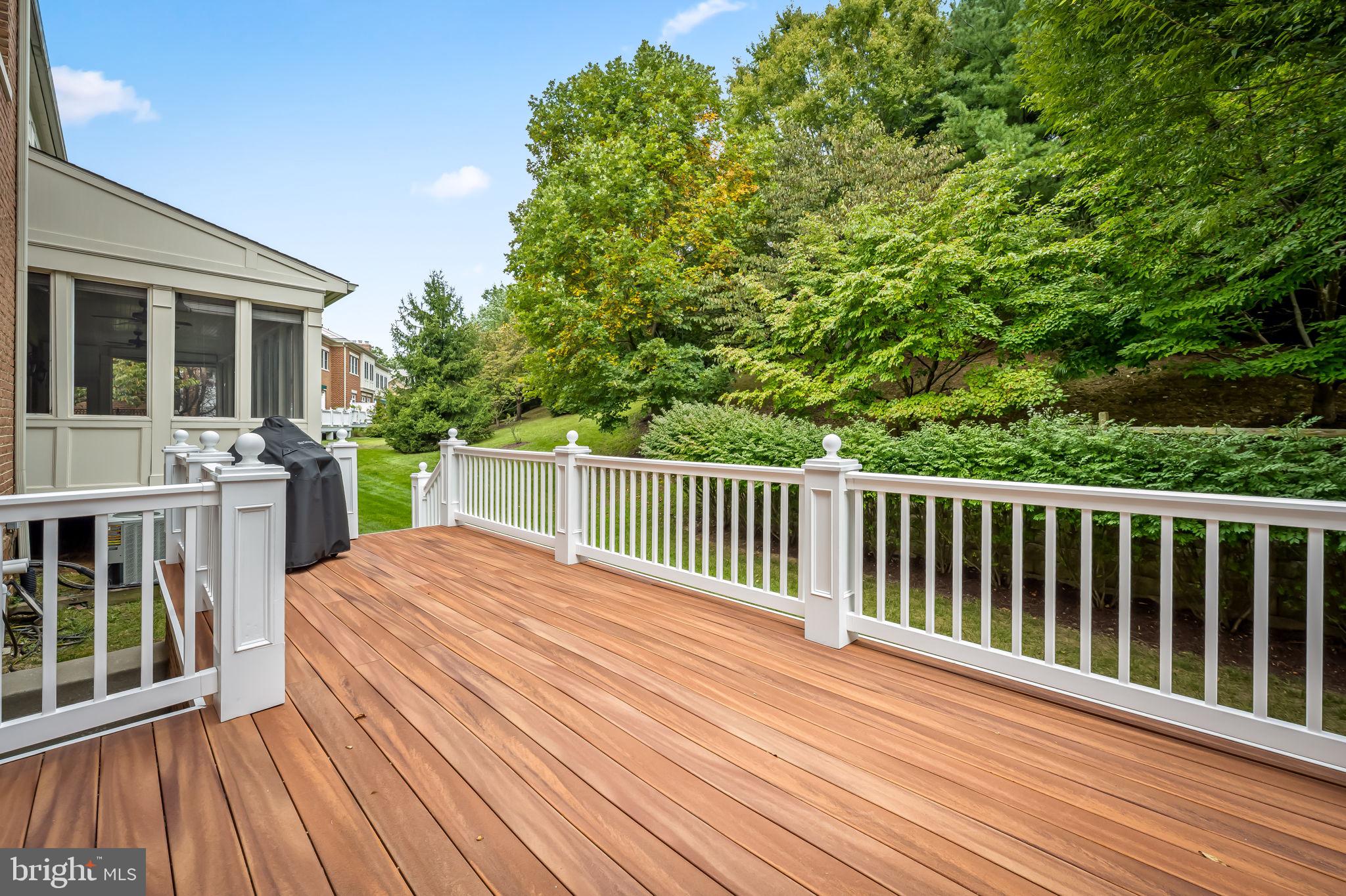 6509 Abbey View Way, Unit 22 Baltimore, MD 21212 - Photo 22 of 54 a view of backyard with deck and wooden floor