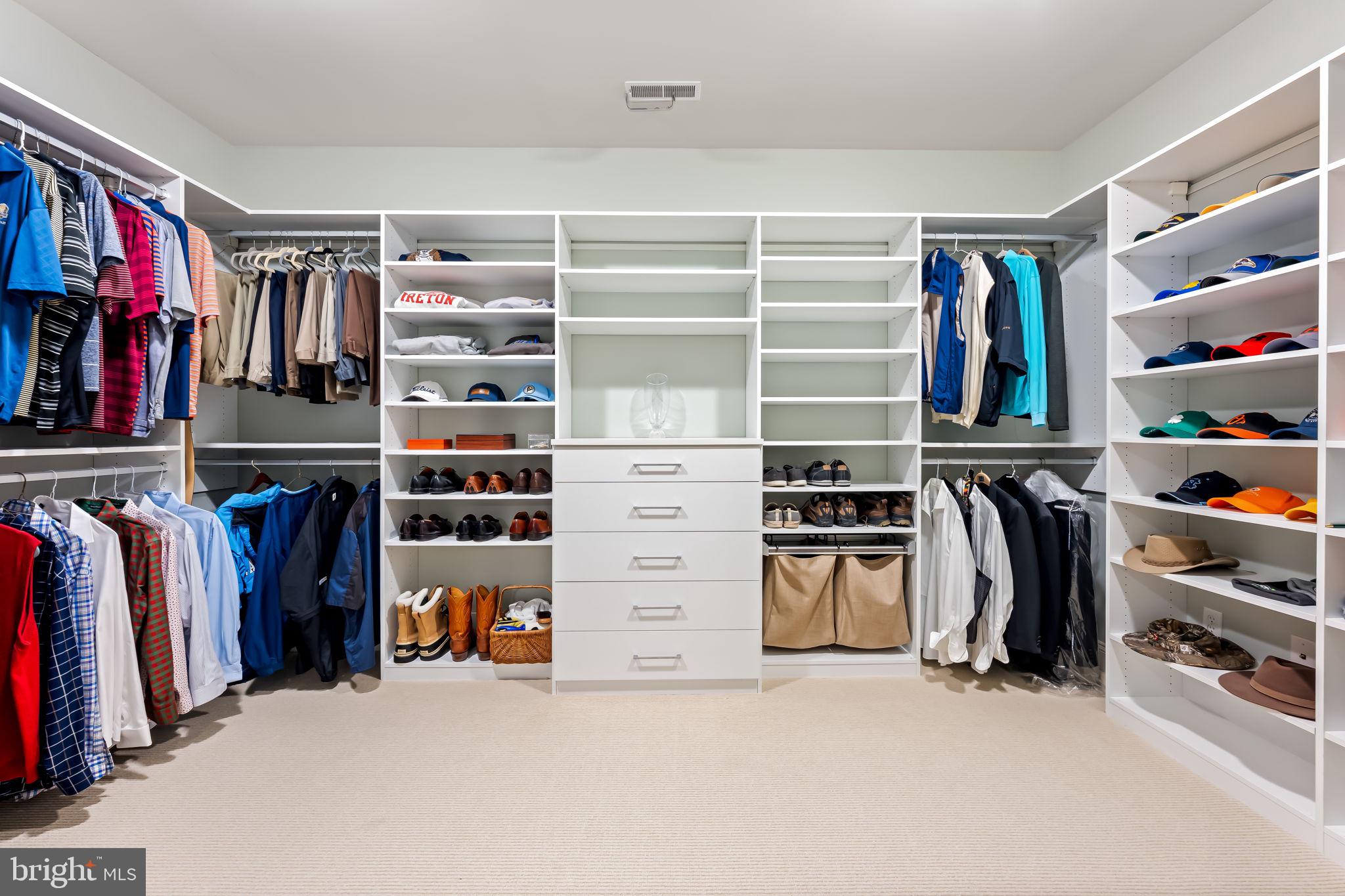 6509 Abbey View Way, Unit 22 Baltimore, MD 21212 - Photo 28 of 54 a view of walk in closet with clothes and shoes
