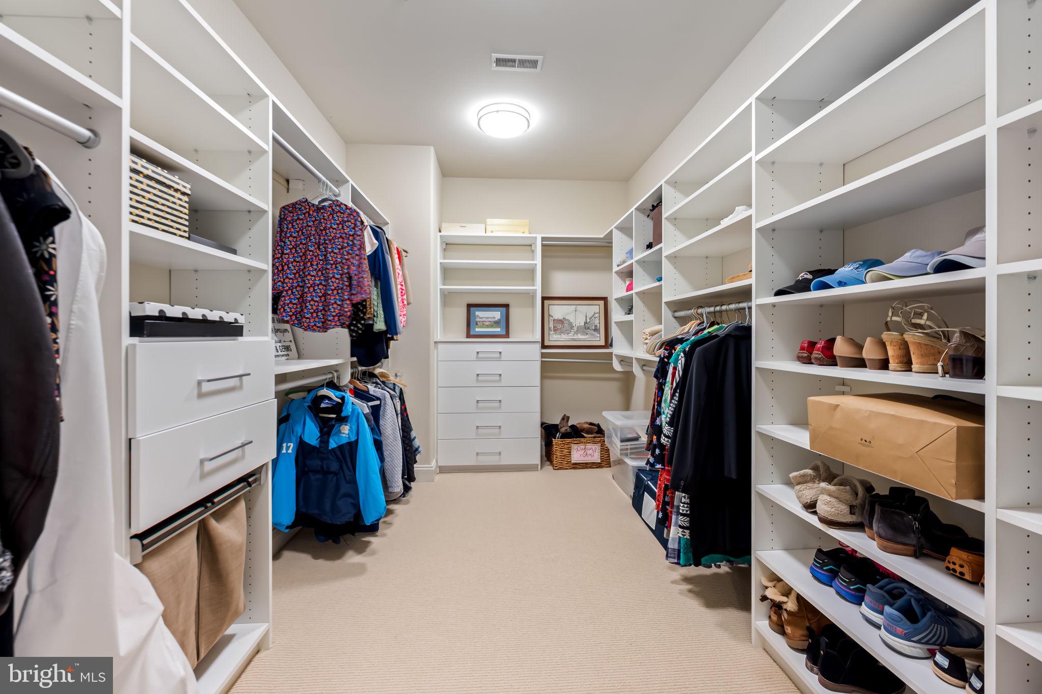 6509 Abbey View Way, Unit 22 Baltimore, MD 21212 - Photo 29 of 54 a view of walk in closet with clothes and shoes