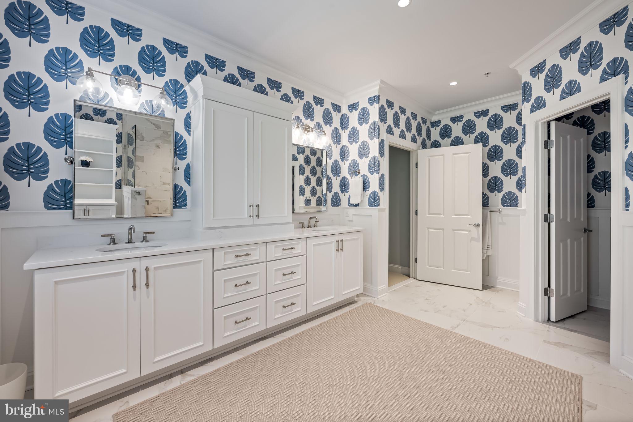 6509 Abbey View Way, Unit 22 Baltimore, MD 21212 - Photo 32 of 54 a spacious bathroom with double vanity and a mirror