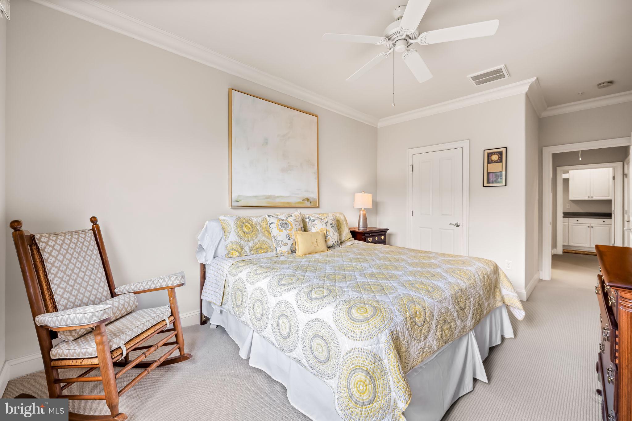 6509 Abbey View Way, Unit 22 Baltimore, MD 21212 - Photo 34 of 54 a bedroom with a bed and a chair