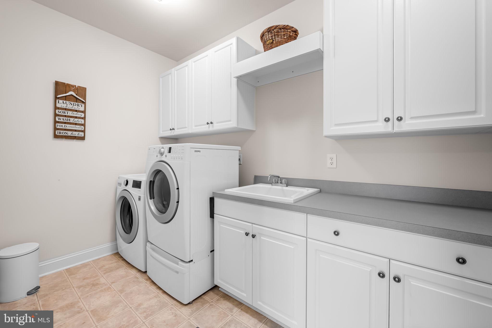 6509 Abbey View Way, Unit 22 Baltimore, MD 21212 - Photo 38 of 54 a utility room with dryer and washer