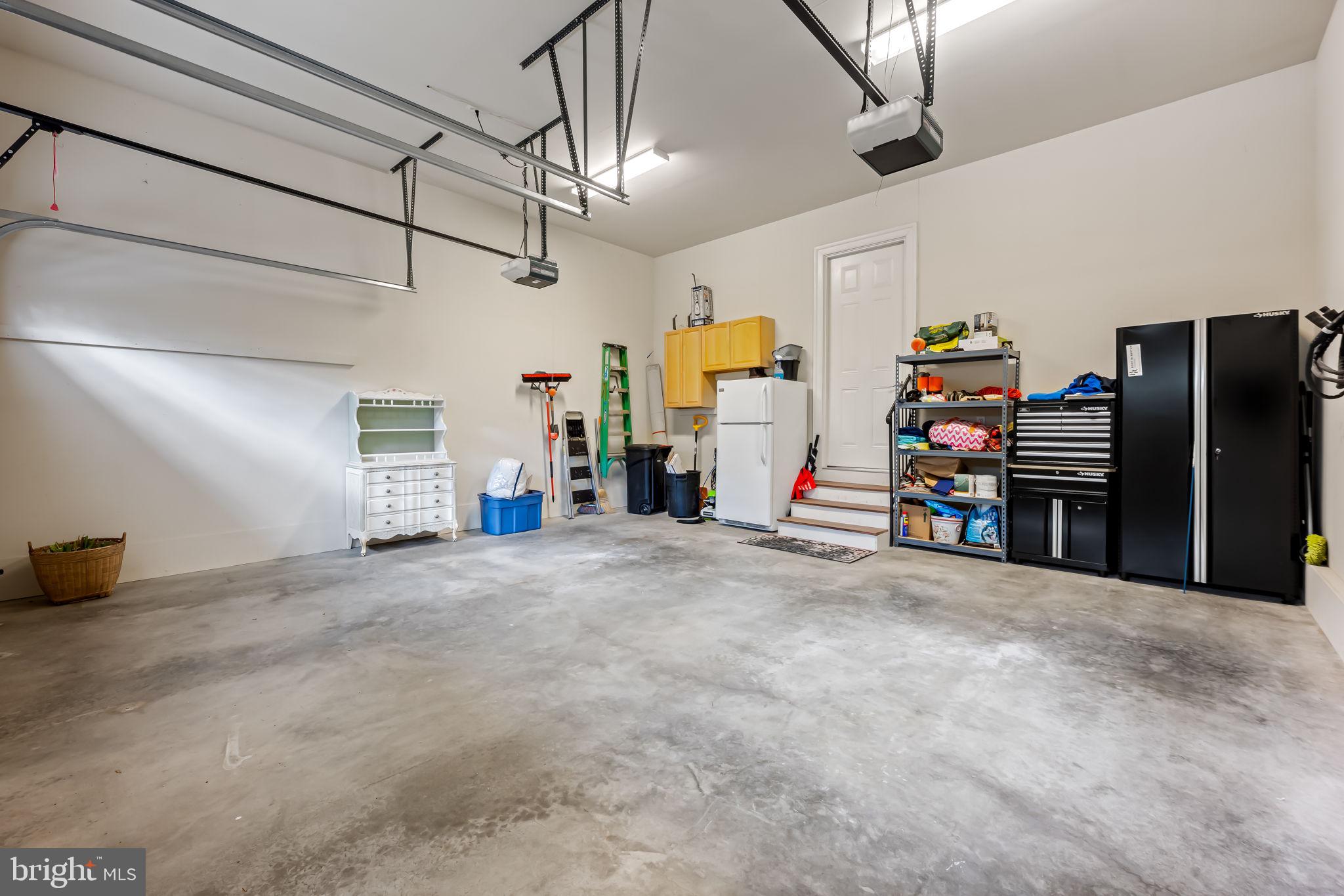 6509 Abbey View Way, Unit 22 Baltimore, MD 21212 - Photo 40 of 54 a view of a garage with furniture and a garage