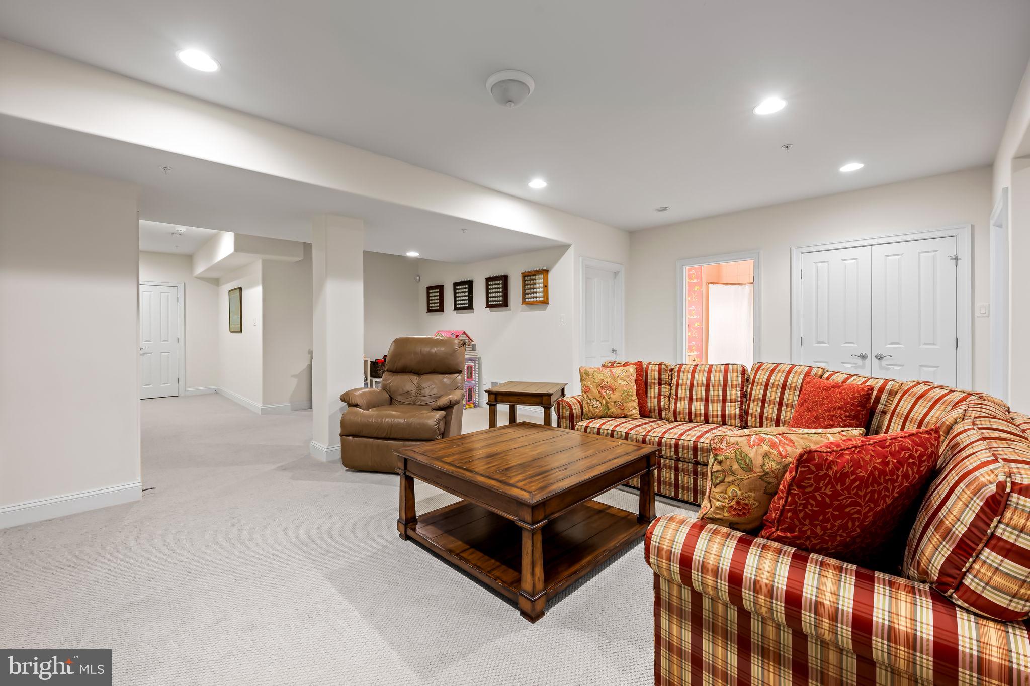 6509 Abbey View Way, Unit 22 Baltimore, MD 21212 - Photo 43 of 54 a living room with furniture and a wooden floor
