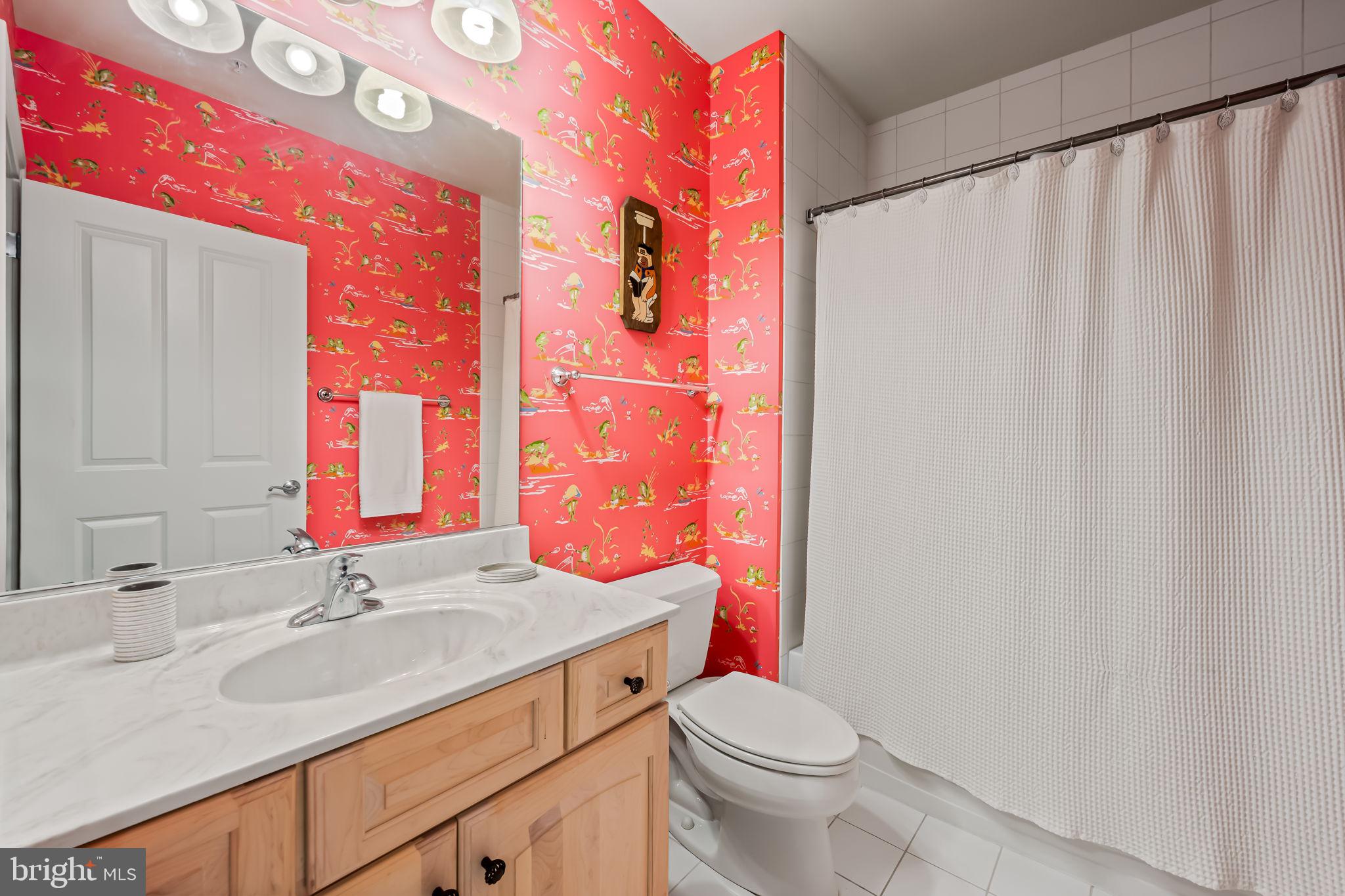 6509 Abbey View Way, Unit 22 Baltimore, MD 21212 - Photo 47 of 54 a bathroom with a granite countertop sink and a toilet