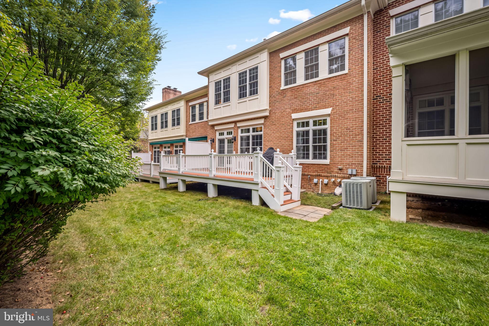 6509 Abbey View Way, Unit 22 Baltimore, MD 21212 - Photo 50 of 54 a view of a house with a yard and sitting area