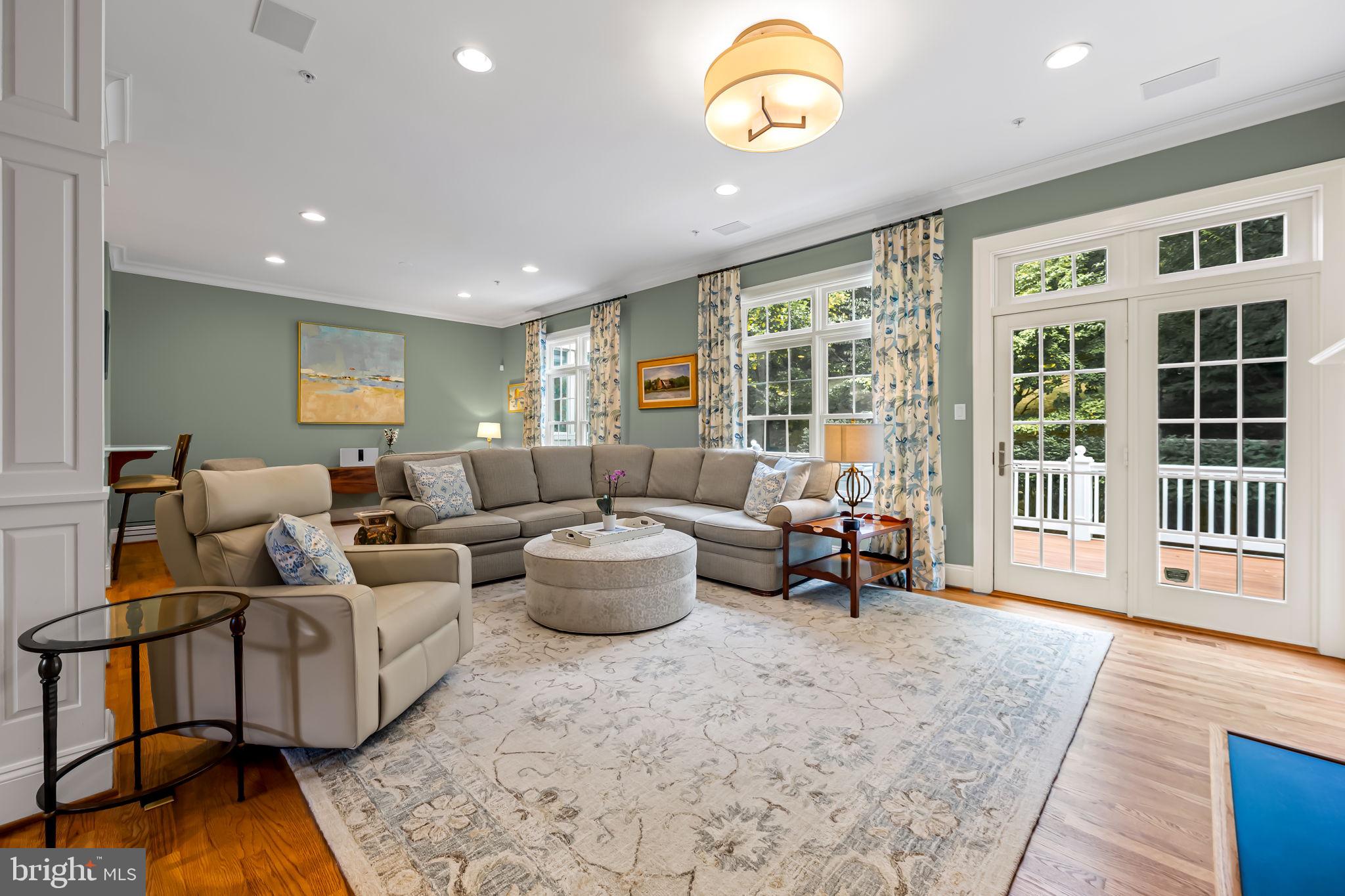 6509 Abbey View Way, Unit 22 Baltimore, MD 21212 - Photo 9 of 54 a living room with furniture and a large window