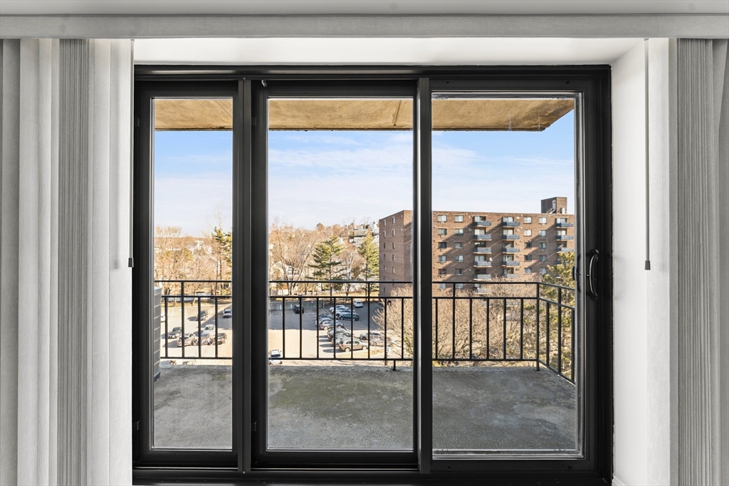 275 Main Street, Unit 205 Watertown, MA 02472 - Photo 12 of 42 a view of a glass door with a from a window