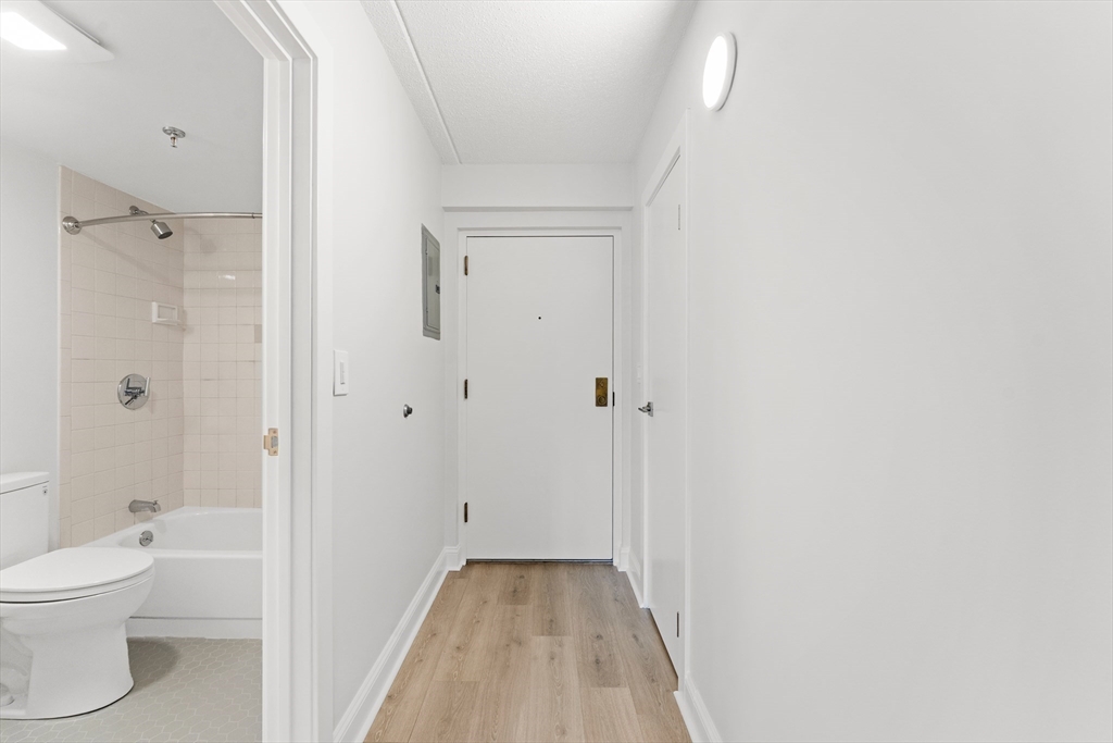 275 Main Street, Unit 205 Watertown, MA 02472 - Photo 18 of 42 a bathroom with a toilet and a shower