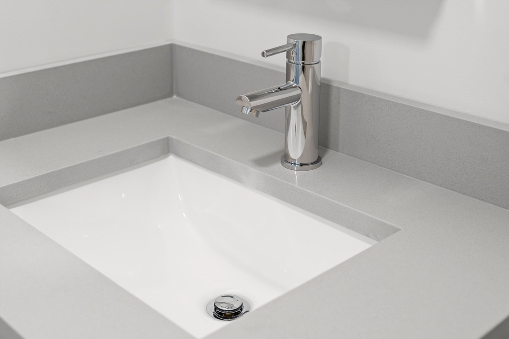 275 Main Street, Unit 205 Watertown, MA 02472 - Photo 21 of 42 a utility room with a sink