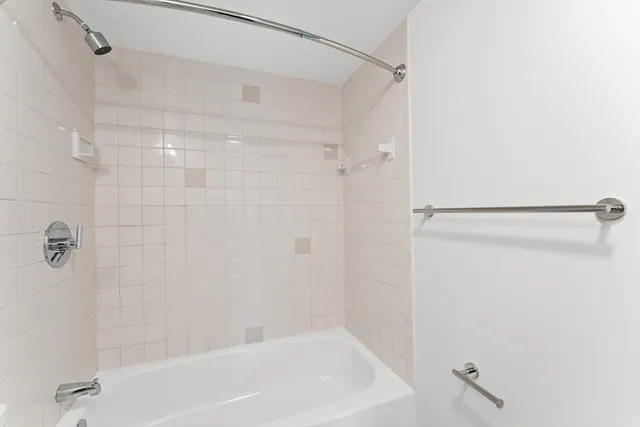 a bathroom with a sink vanity and a mirror