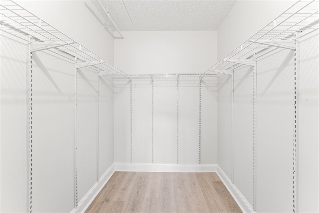 275 Main Street, Unit 205 Watertown, MA 02472 - Photo 34 of 42 a view of a room with racks on the wall