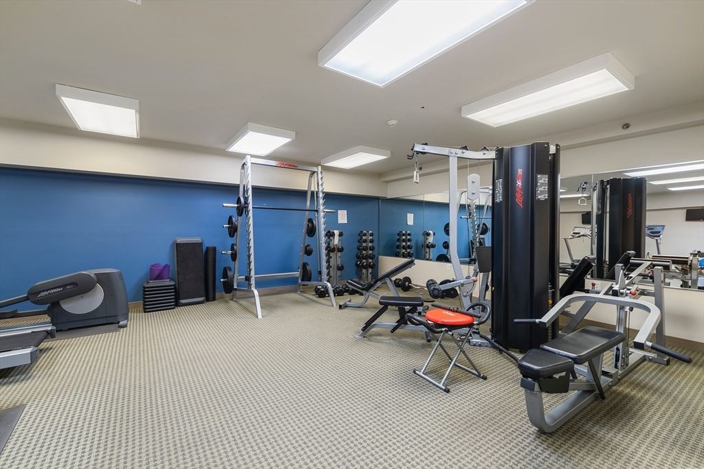 275 Main Street, Unit 205 Watertown, MA 02472 - Photo 35 of 42 a room with gym equipment and white walls