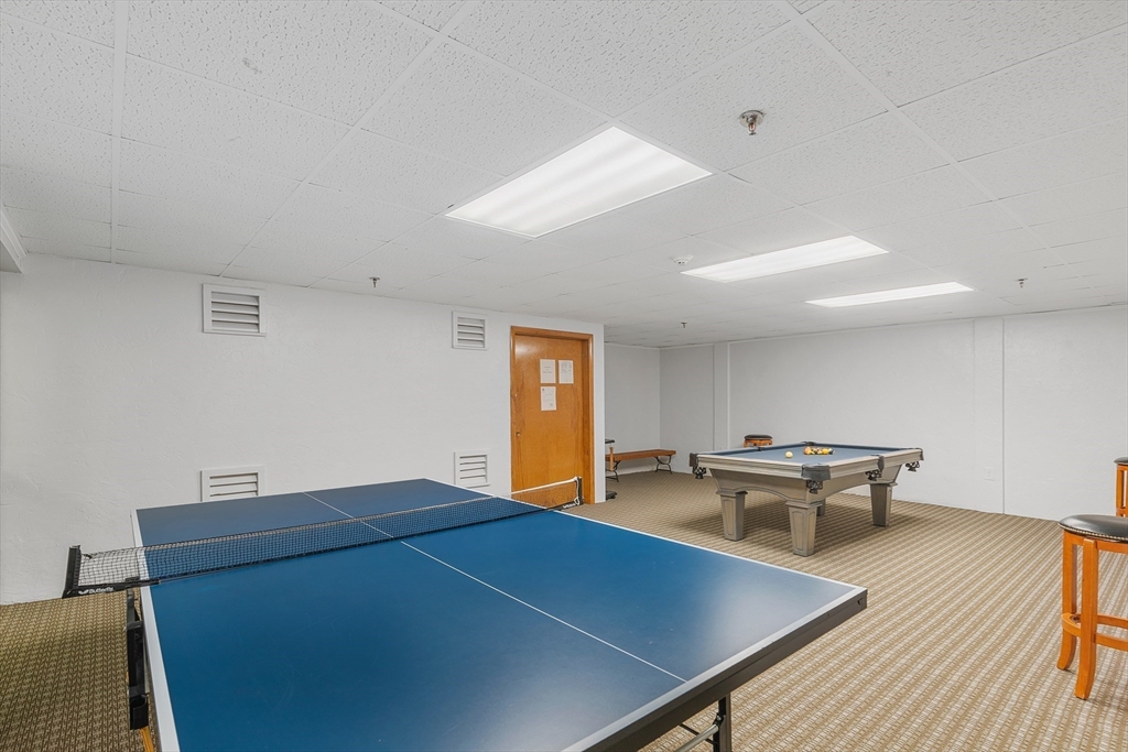 275 Main Street, Unit 205 Watertown, MA 02472 - Photo 39 of 42 a room with furniture pool table and wooden floor