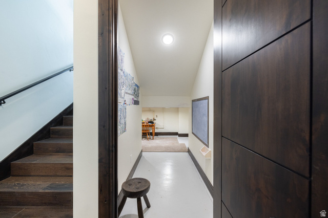 11547 Soaring Hawk Lane Hideout, UT 84036 - Photo 35 of 43 Hallway with white flooring, contemporary dark wood-finish door, and recessed ceiling lighting