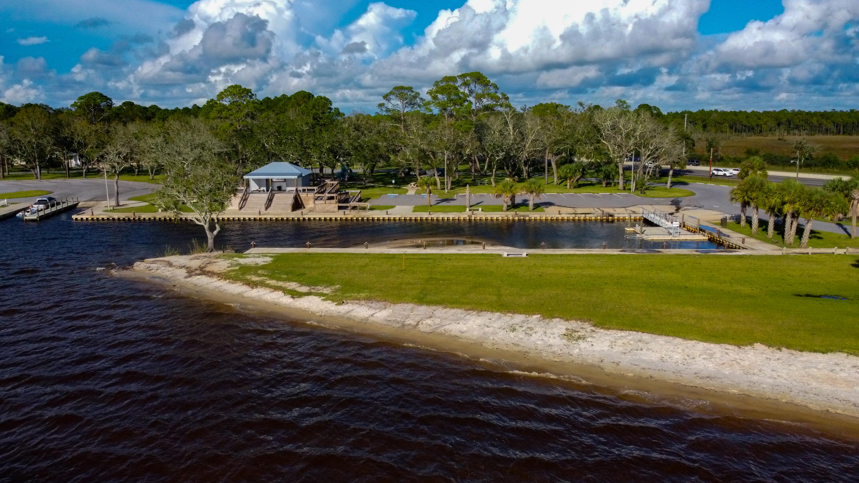 Lot 6-1 Bay Grove Road Freeport, FL 32439 - Photo 17 of 18 a view of a swimming pool with lawn chairs under an umbrella