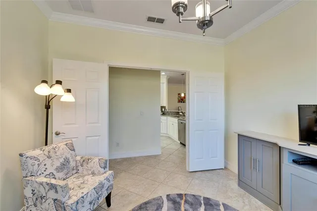 an aerial view of a house with outdoor space and a lake view