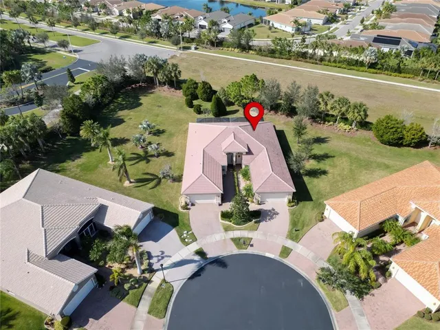 an aerial view of a house swimming pool and patio