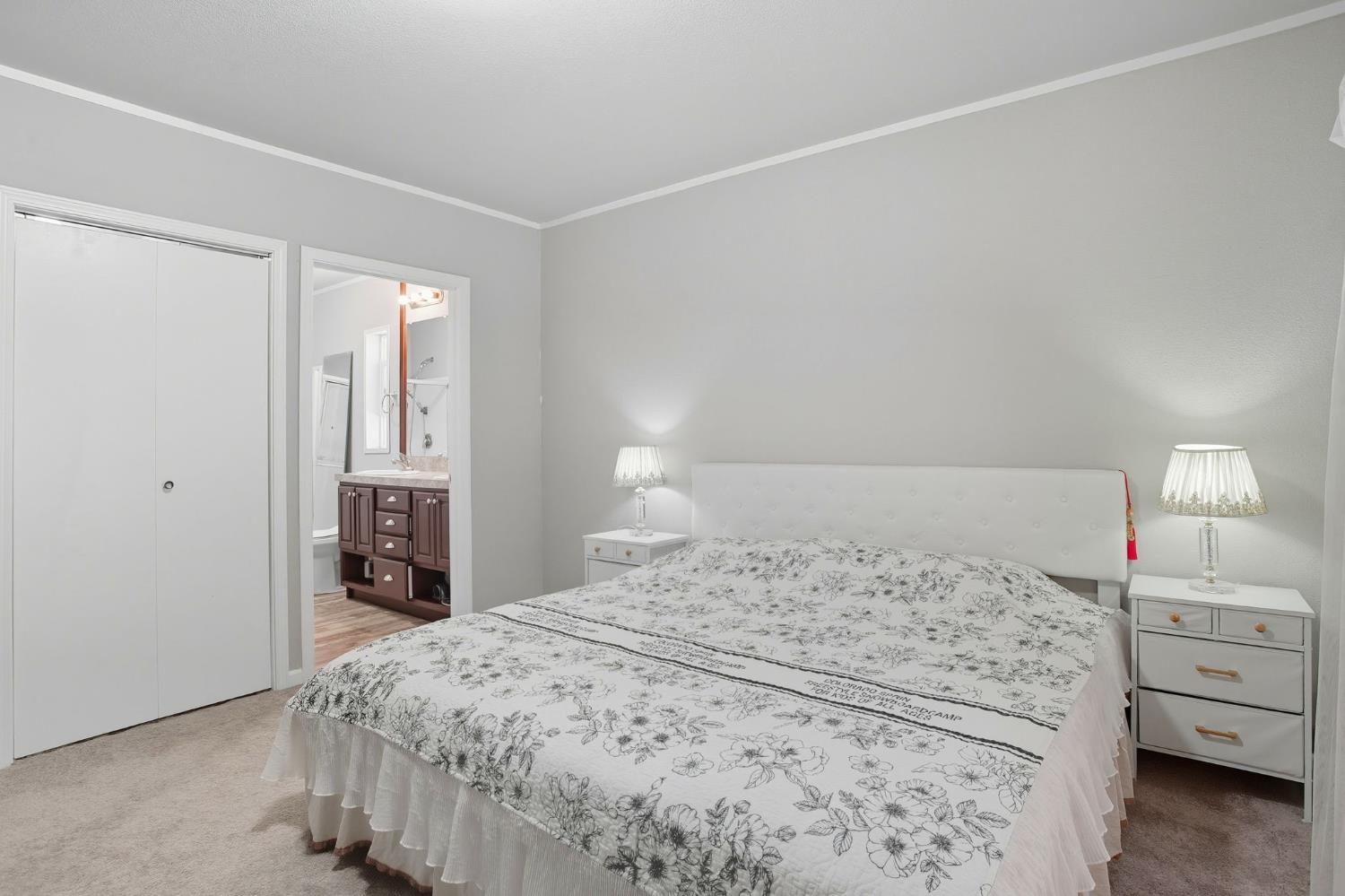 8665 Florin Road, Unit 133 Sacramento, CA 95828 - Photo 14 of 38 a bedroom with a bed and a closet