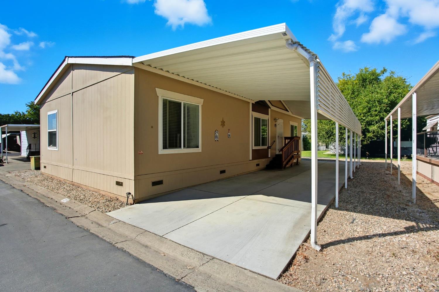 8665 Florin Road, Unit 133 Sacramento, CA 95828 - Photo 2 of 38 a view of a house with a backyard