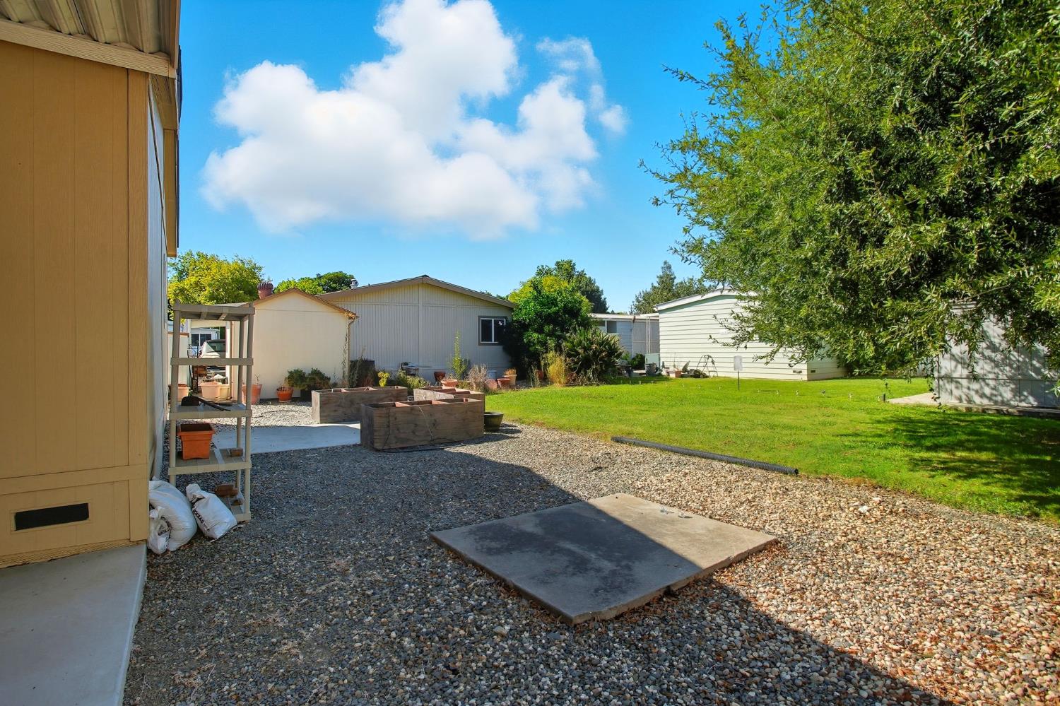 8665 Florin Road, Unit 133 Sacramento, CA 95828 - Photo 27 of 38 a view of a backyard with sitting area