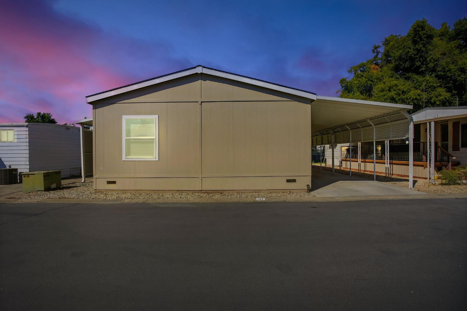 8665 Florin Road, Unit 133 Sacramento, CA 95828 - Photo 30 of 38 a view of a house with a yard