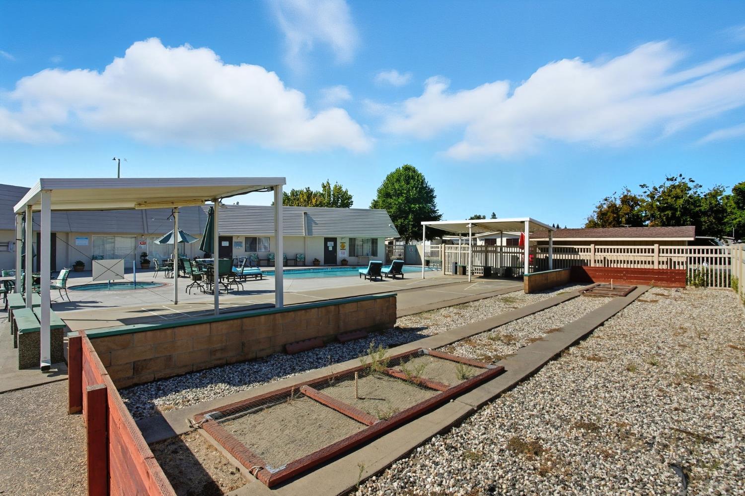 8665 Florin Road, Unit 133 Sacramento, CA 95828 - Photo 35 of 38 a view of house with swimming pool and sitting area