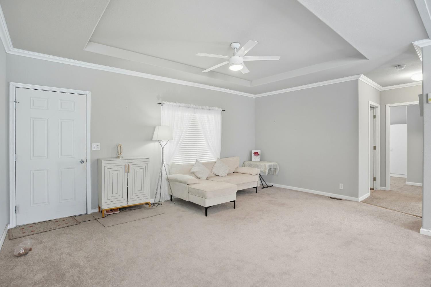 8665 Florin Road, Unit 133 Sacramento, CA 95828 - Photo 5 of 38 a living room with furniture and white walls