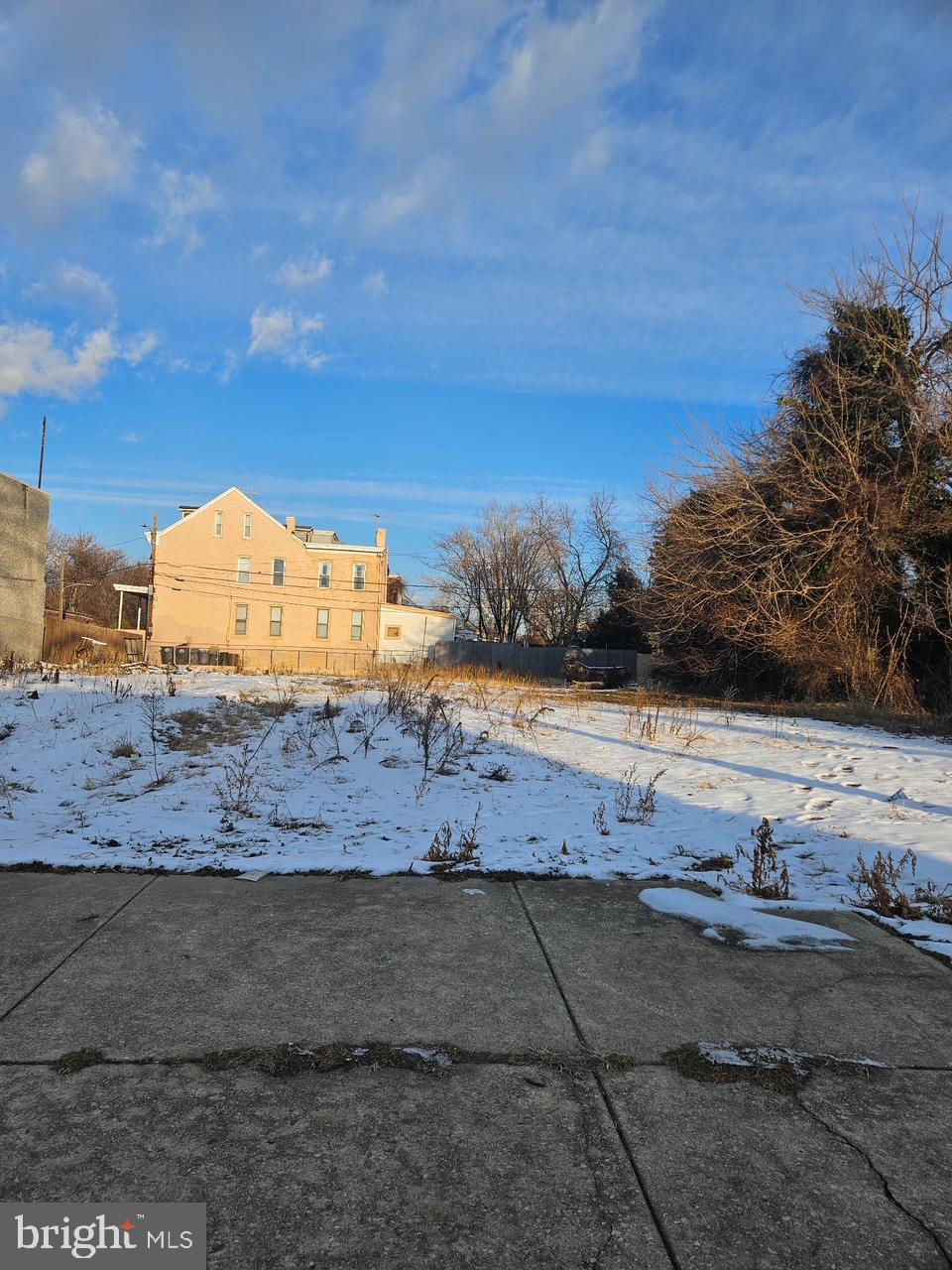 1208 West 3rd Street Chester, PA 19013 - Photo 2 of 2 a view of a dry yard with a house