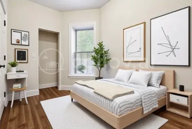 a bedroom with a bed lamp closet and window