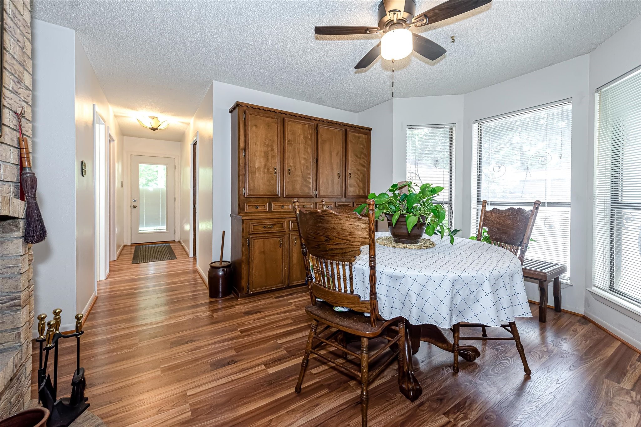 7715 Shadow Lane Conroe, TX 77304 - Photo 17 of 46 a dining room with furniture window wooden floor