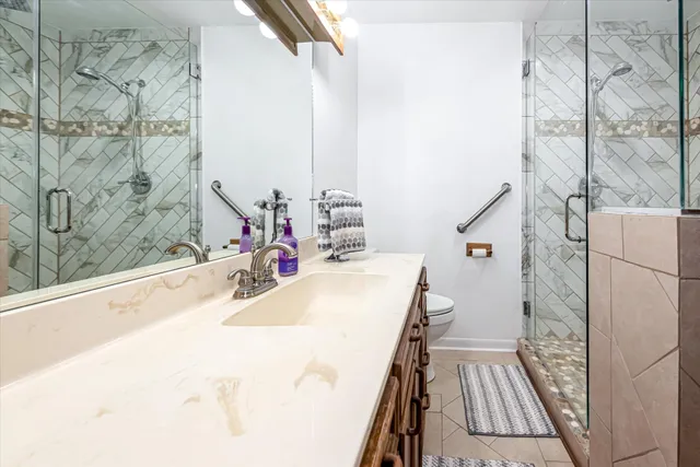 a bathroom with a sink and mirror