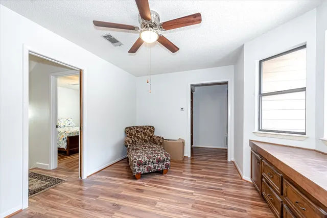 a view of livingroom with hardwood floor and hallway