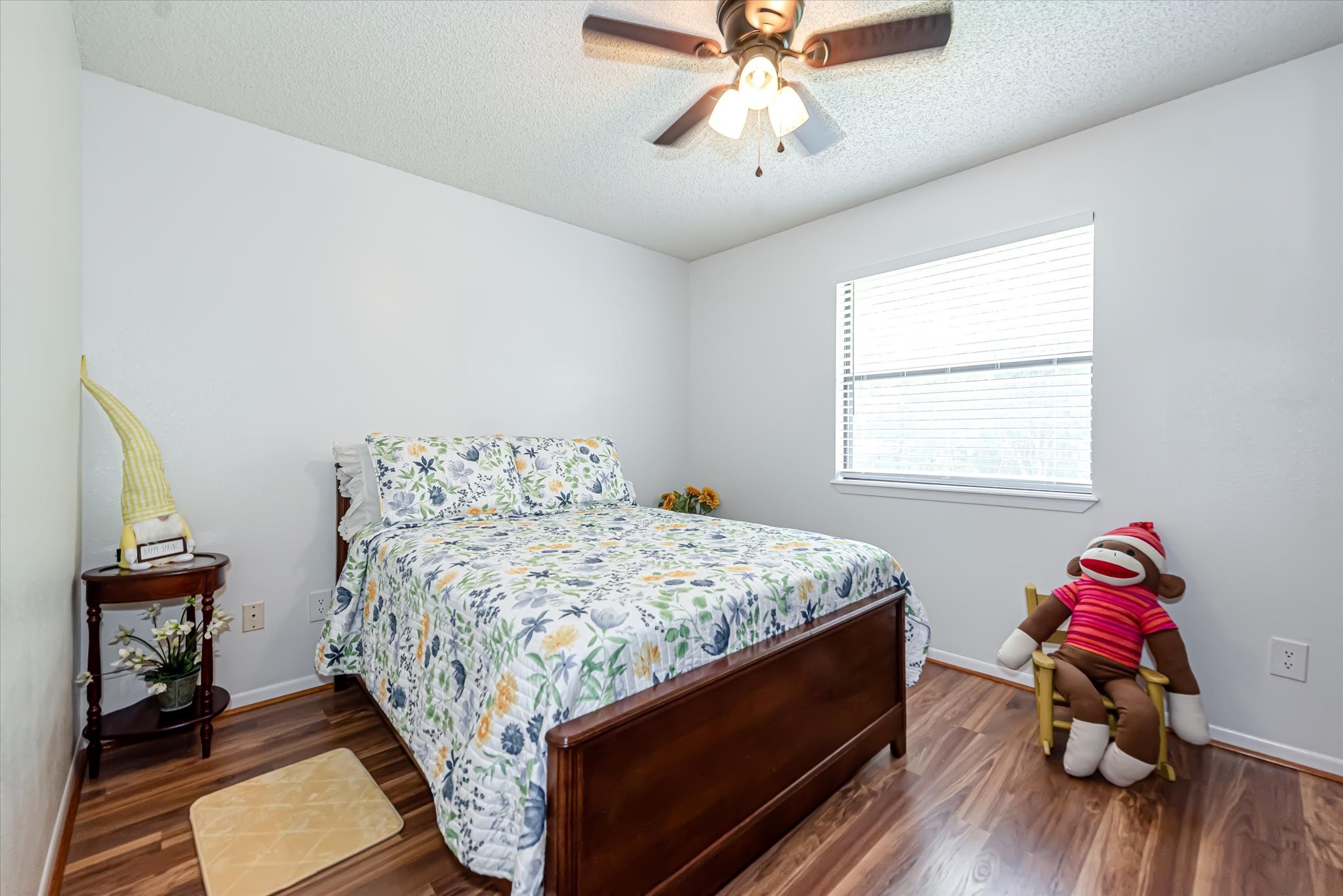 7715 Shadow Lane Conroe, TX 77304 - Photo 32 of 46 a bedroom with a bed and wooden floor