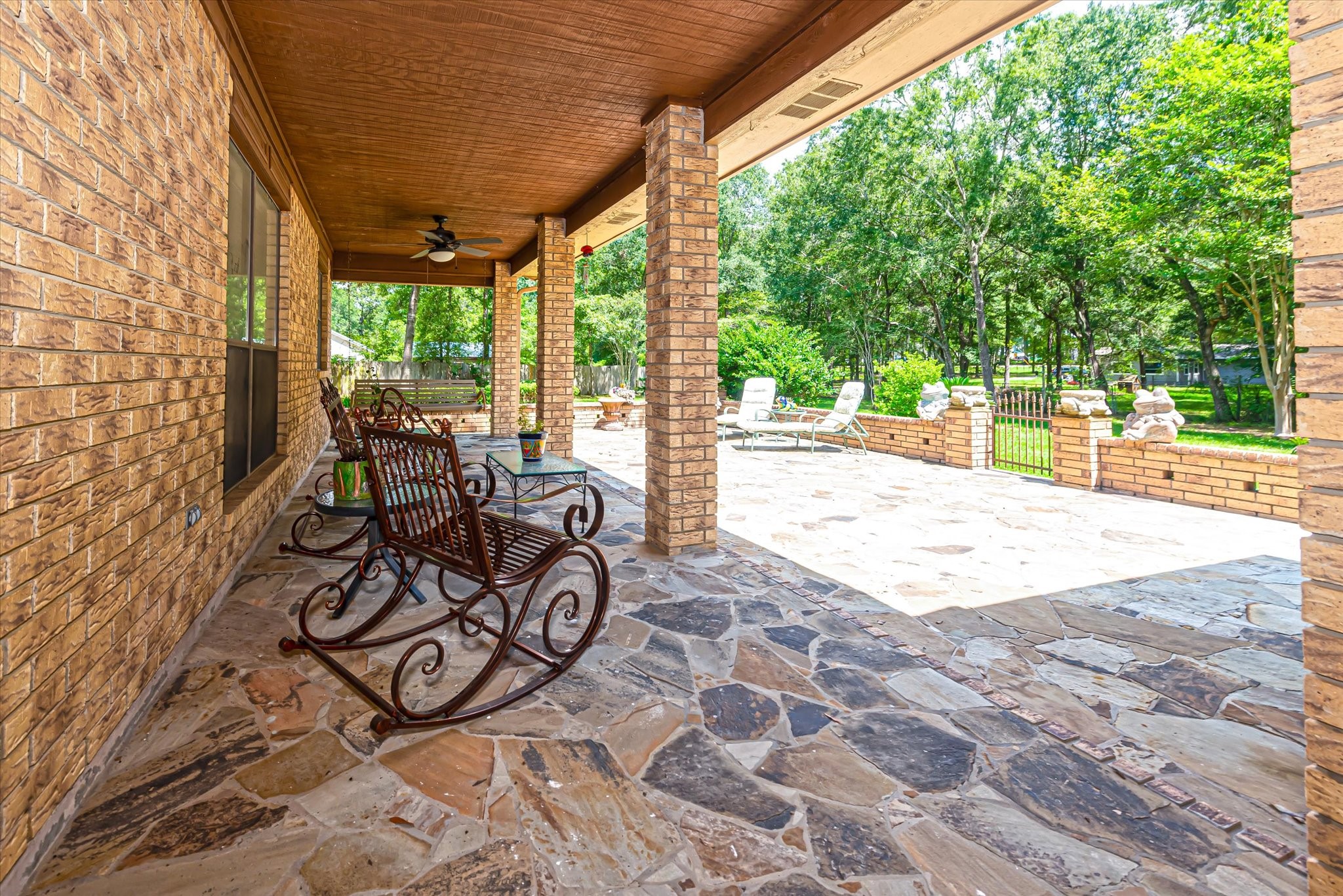 7715 Shadow Lane Conroe, TX 77304 - Photo 36 of 46 a view of a patio with a table and chairs