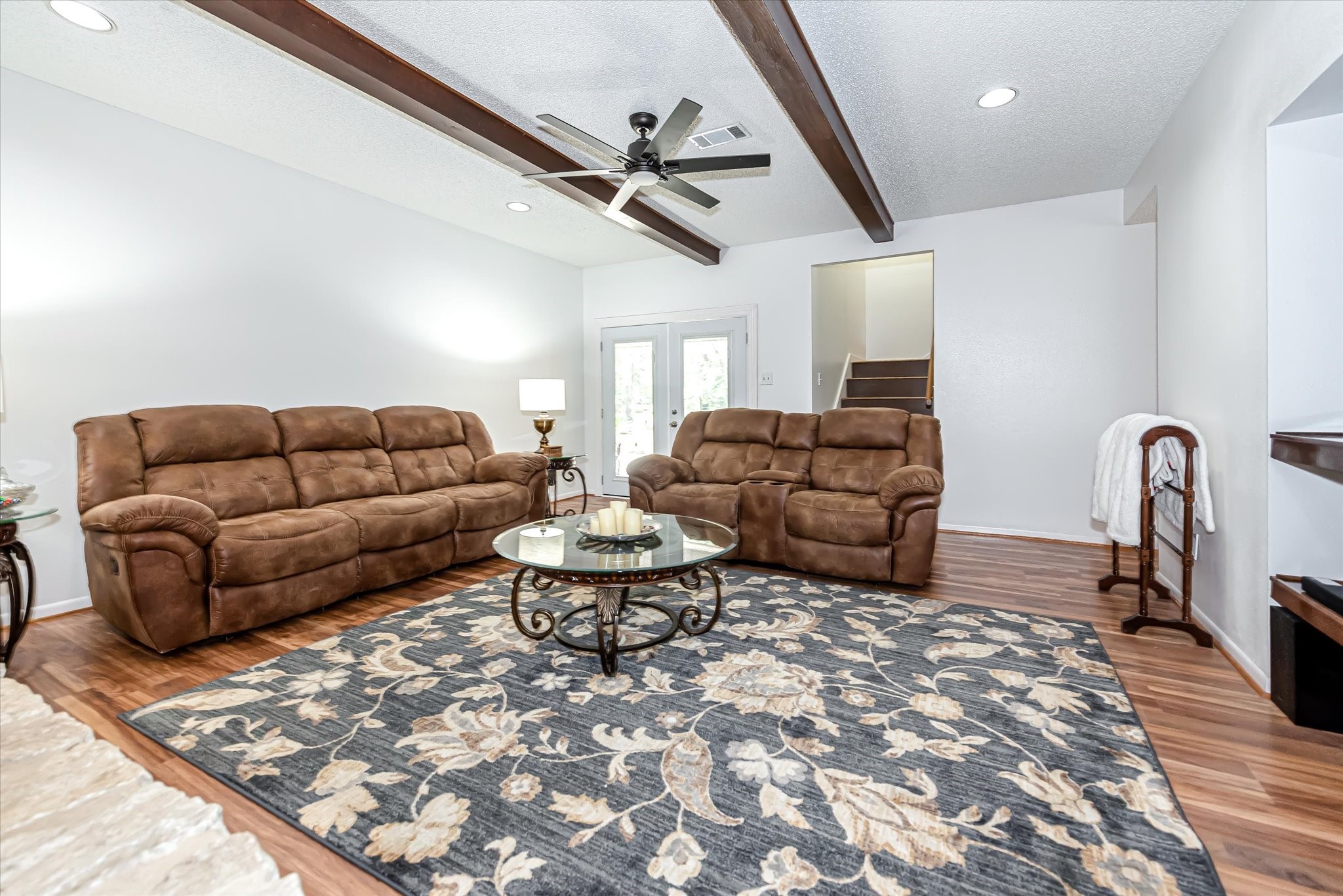 7715 Shadow Lane Conroe, TX 77304 - Photo 9 of 46 a living room with furniture a couch and a chandelier