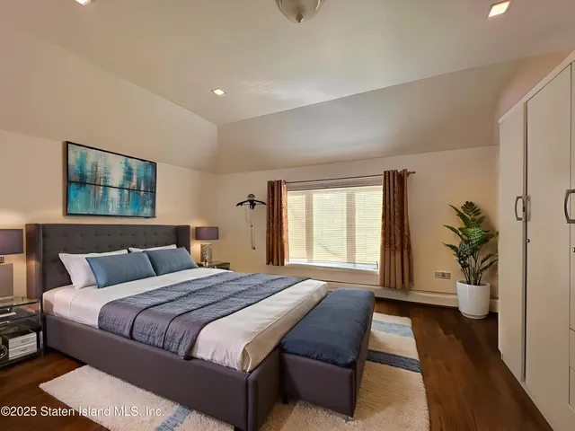 a bedroom with a bed and a dresser