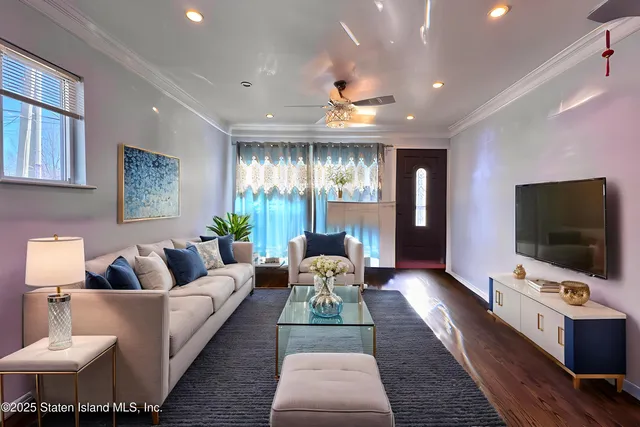 a living room with furniture and a flat screen tv