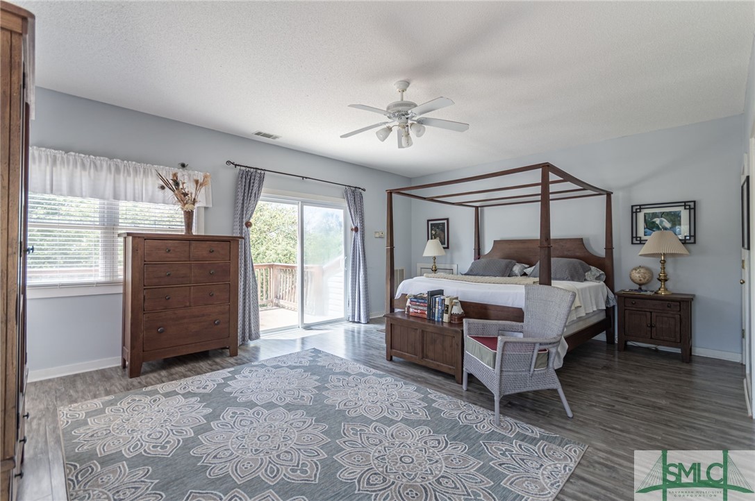 5 Pine Street Tybee Island, GA 31328 - Photo 22 of 35 Primary suite upstairs with doors to open wrap por
