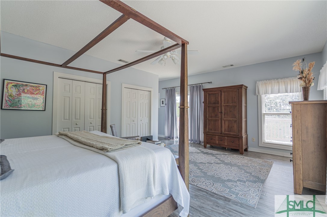 5 Pine Street Tybee Island, GA 31328 - Photo 23 of 35 Primary suite upstairs with his and her closets.