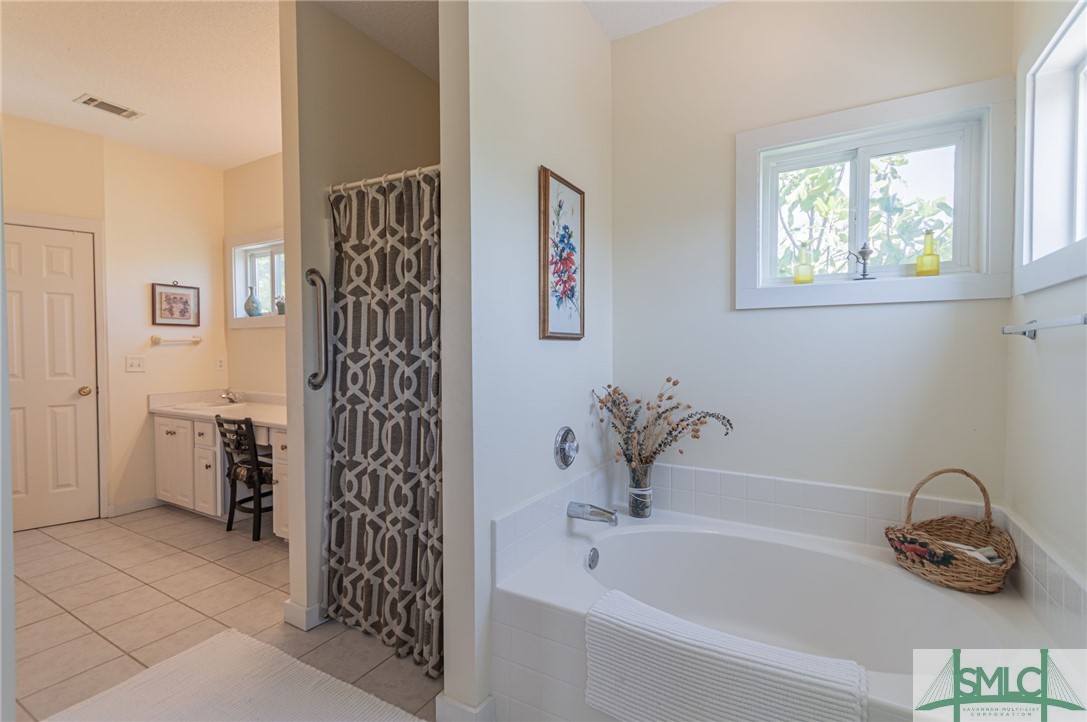 5 Pine Street Tybee Island, GA 31328 - Photo 26 of 35 Primary en-suite with garden tub and separate stan