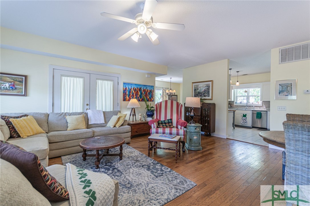 5 Pine Street Tybee Island, GA 31328 - Photo 5 of 35 Spacious living area with doors to screened in por