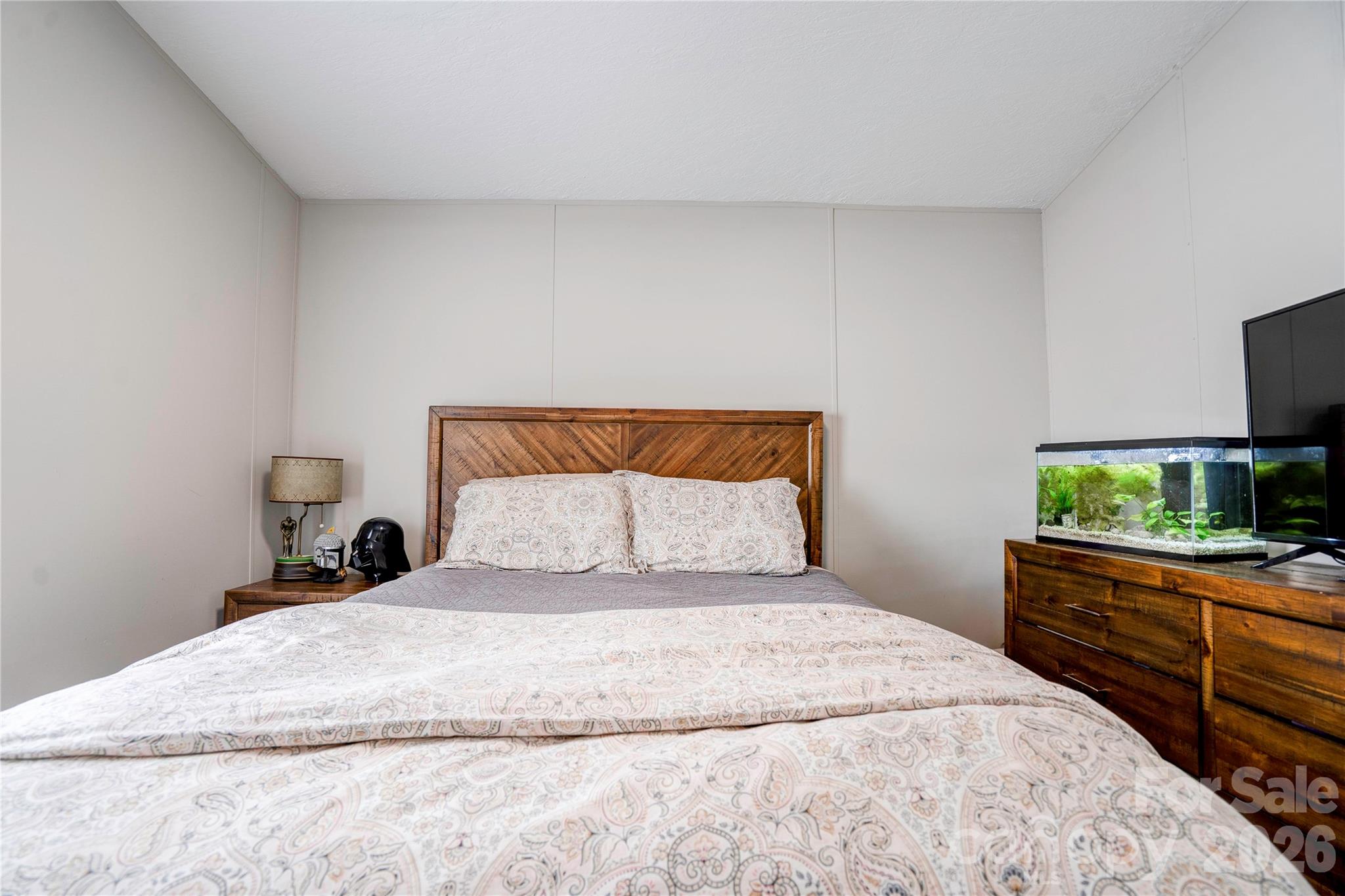 251 Indian Trail Rutherfordton, NC 28139 - Photo 30 of 37 a bedroom with a bed and a flat screen tv