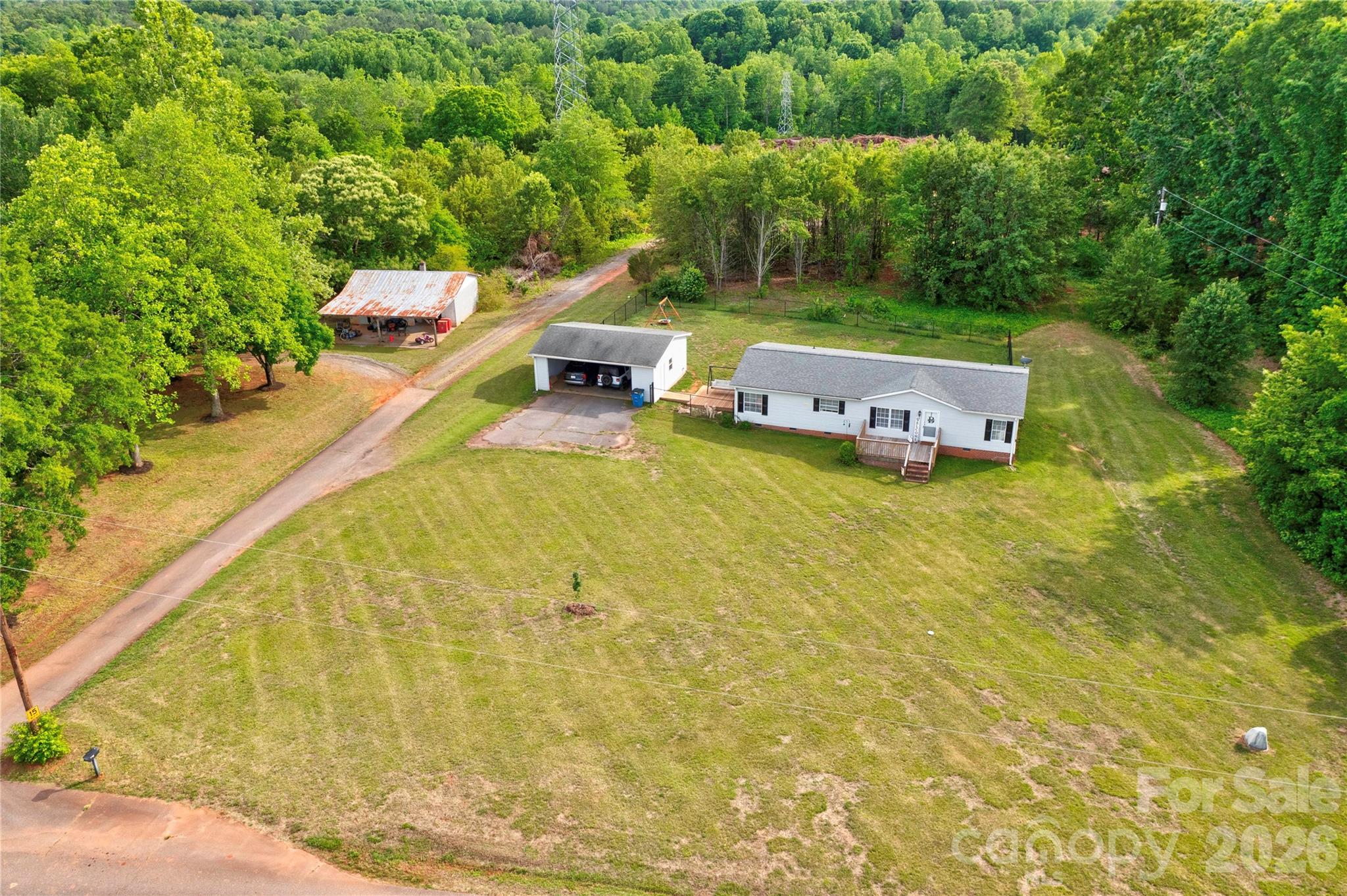 251 Indian Trail Rutherfordton, NC 28139 - Photo 3 of 37 a backyard of a house with table and chairs