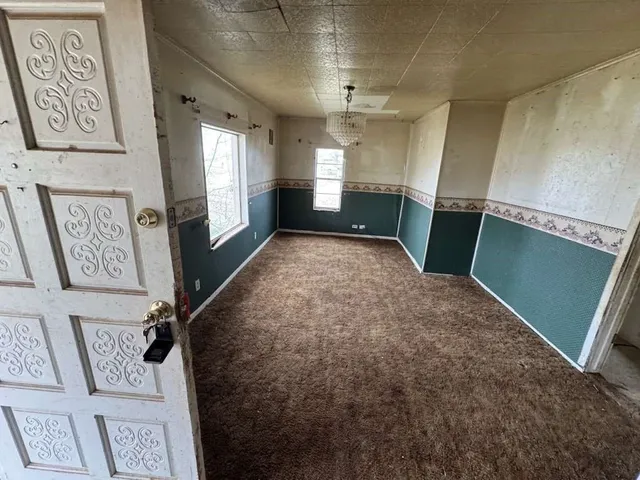 a view of entryway with stairs and wooden floor