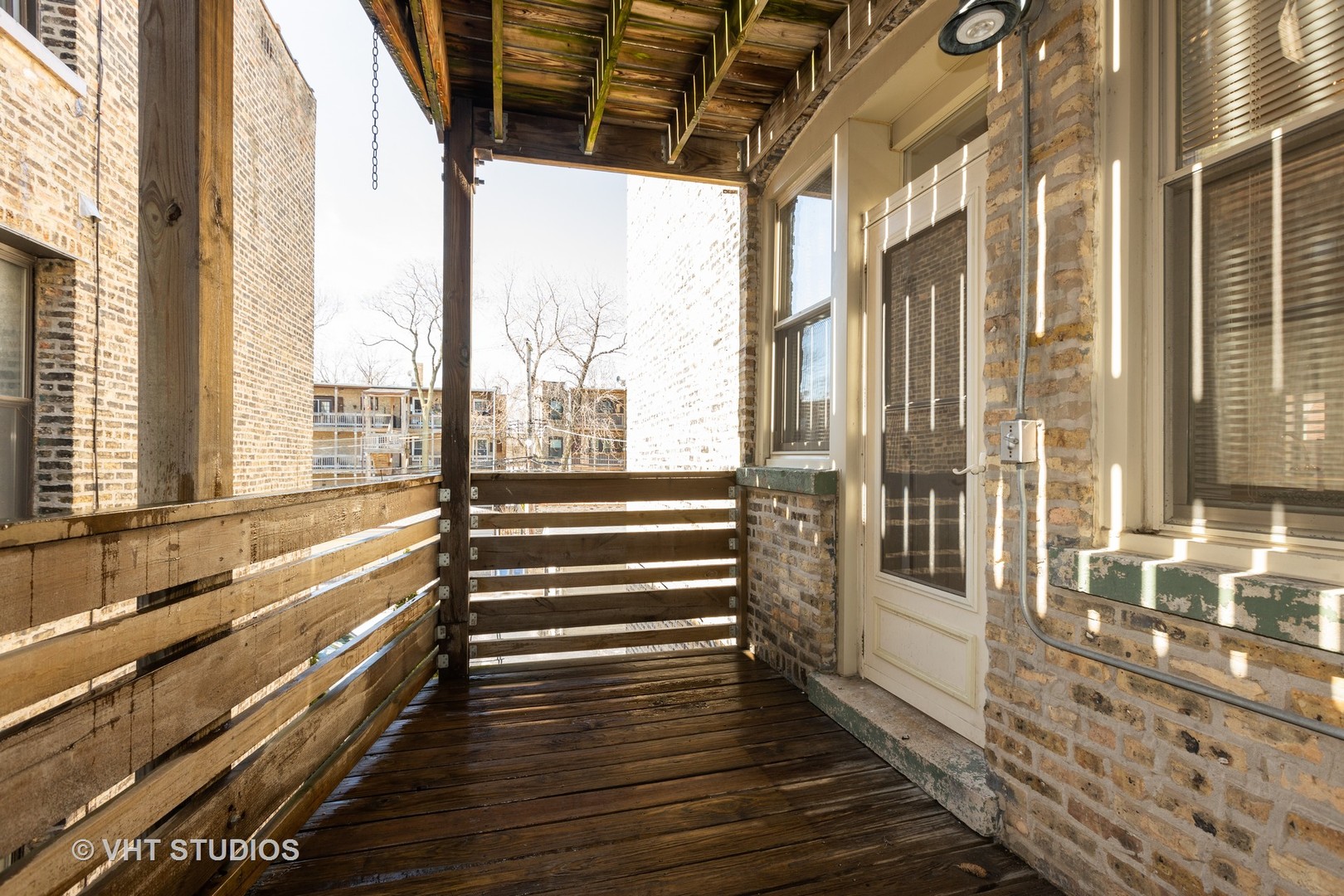 4632 North Racine Avenue, Unit 2 Chicago, IL 60640 - Photo 12 of 12 a view of a large room with wooden floor and windows