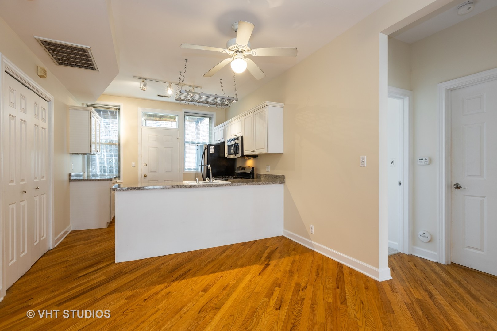 4632 North Racine Avenue, Unit 2 Chicago, IL 60640 - Photo 6 of 12 a view of empty room with wooden floor