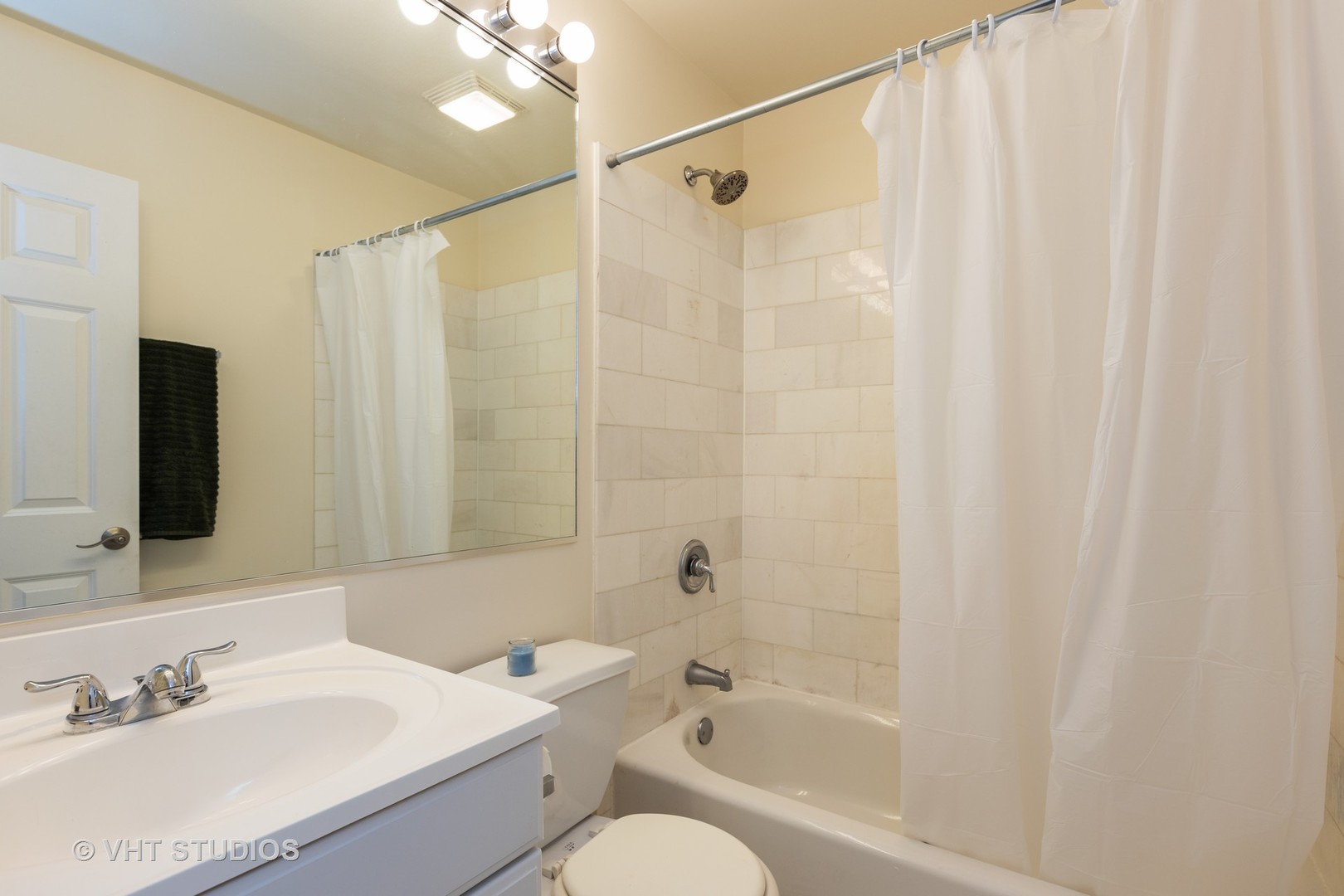 4632 North Racine Avenue, Unit 2 Chicago, IL 60640 - Photo 10 of 12 a bathroom with a sink toilet and shower